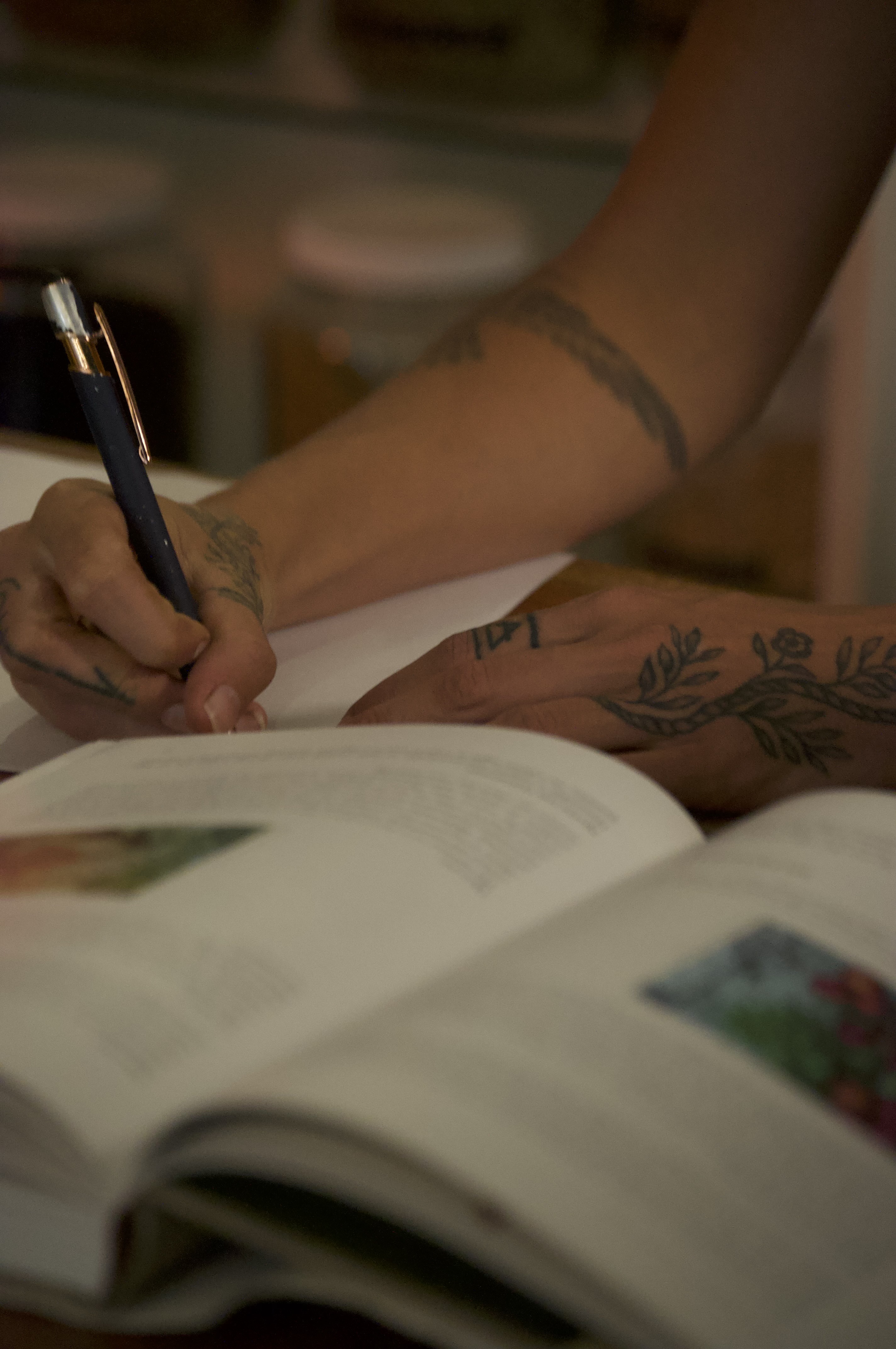 Alora studying and writing in herbal medicine books