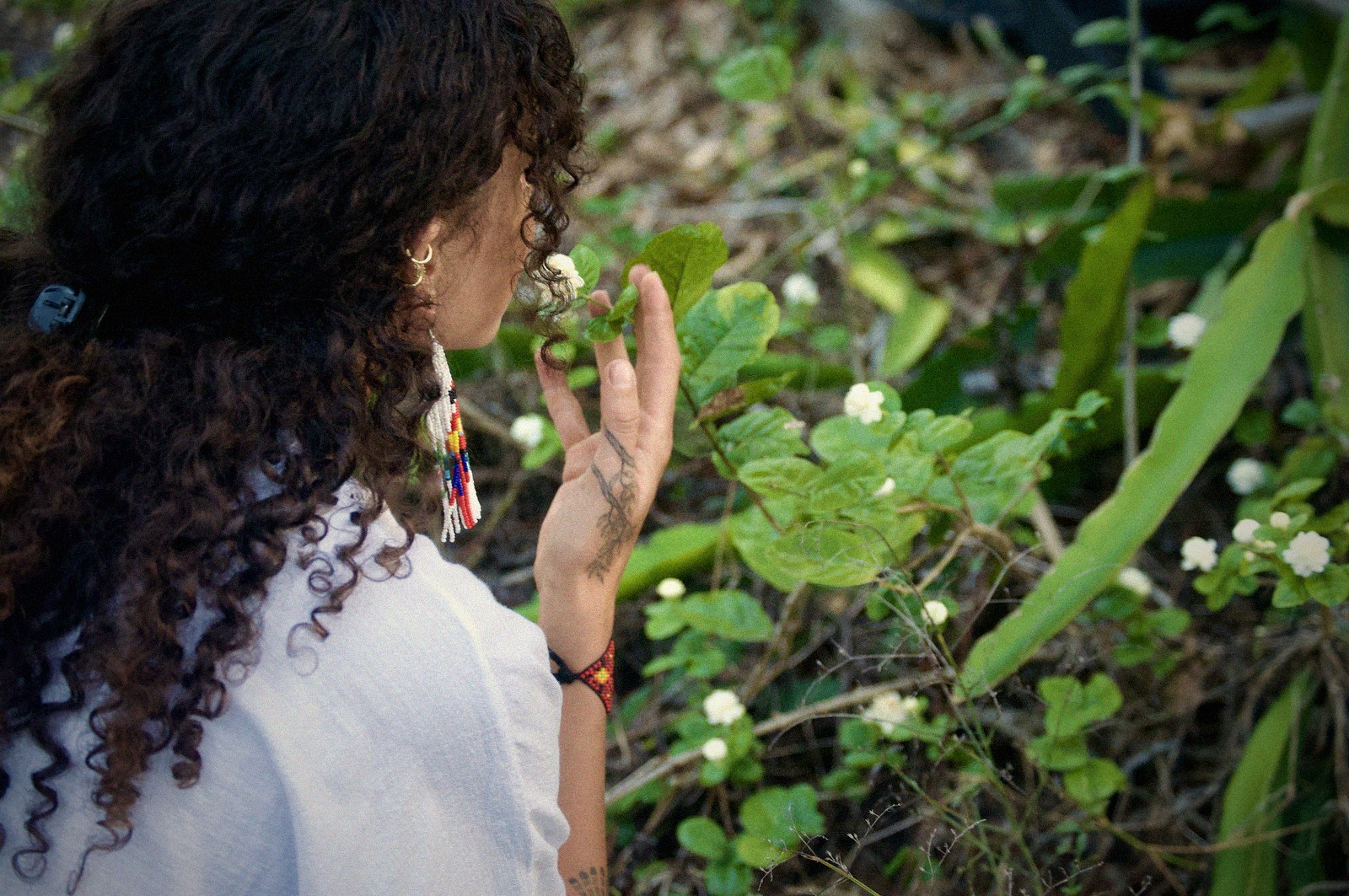Alora touching plants