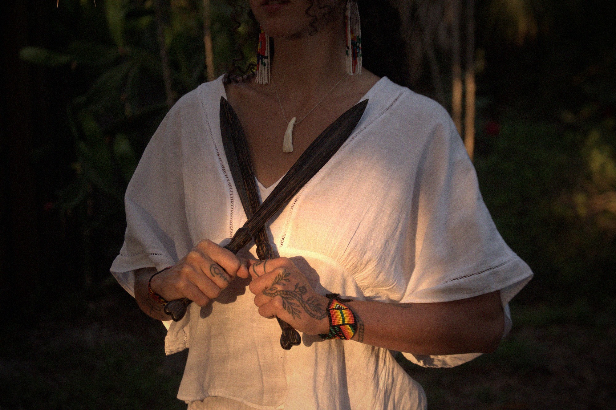 Alora holding feathers