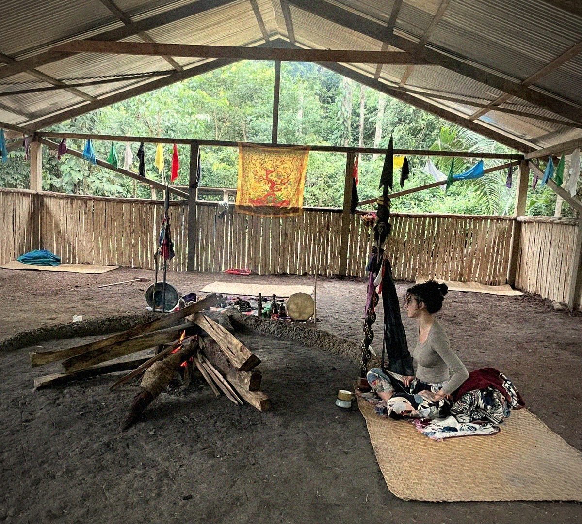 Alora sitting by ceremonial fire
